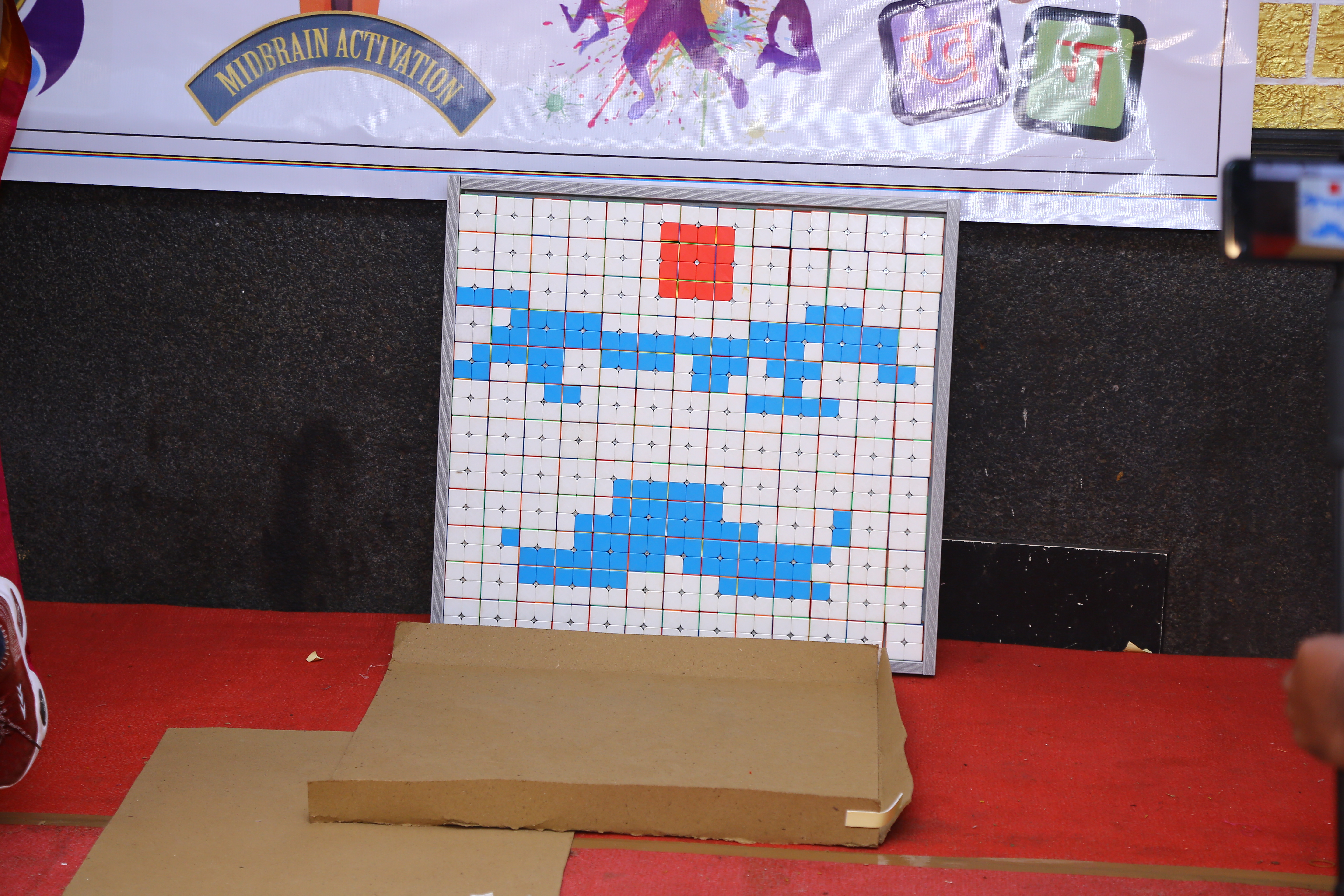 World record by arranging 156 number of 2*2 Rubik's Cube in the   formation of Bharathiyar 's face under the theme of "ROWTHIRAM PAZHAGU"  by reciting Bharathiyar 's Puthiya Aathichudi SIMULTANEOUSLy in least time.