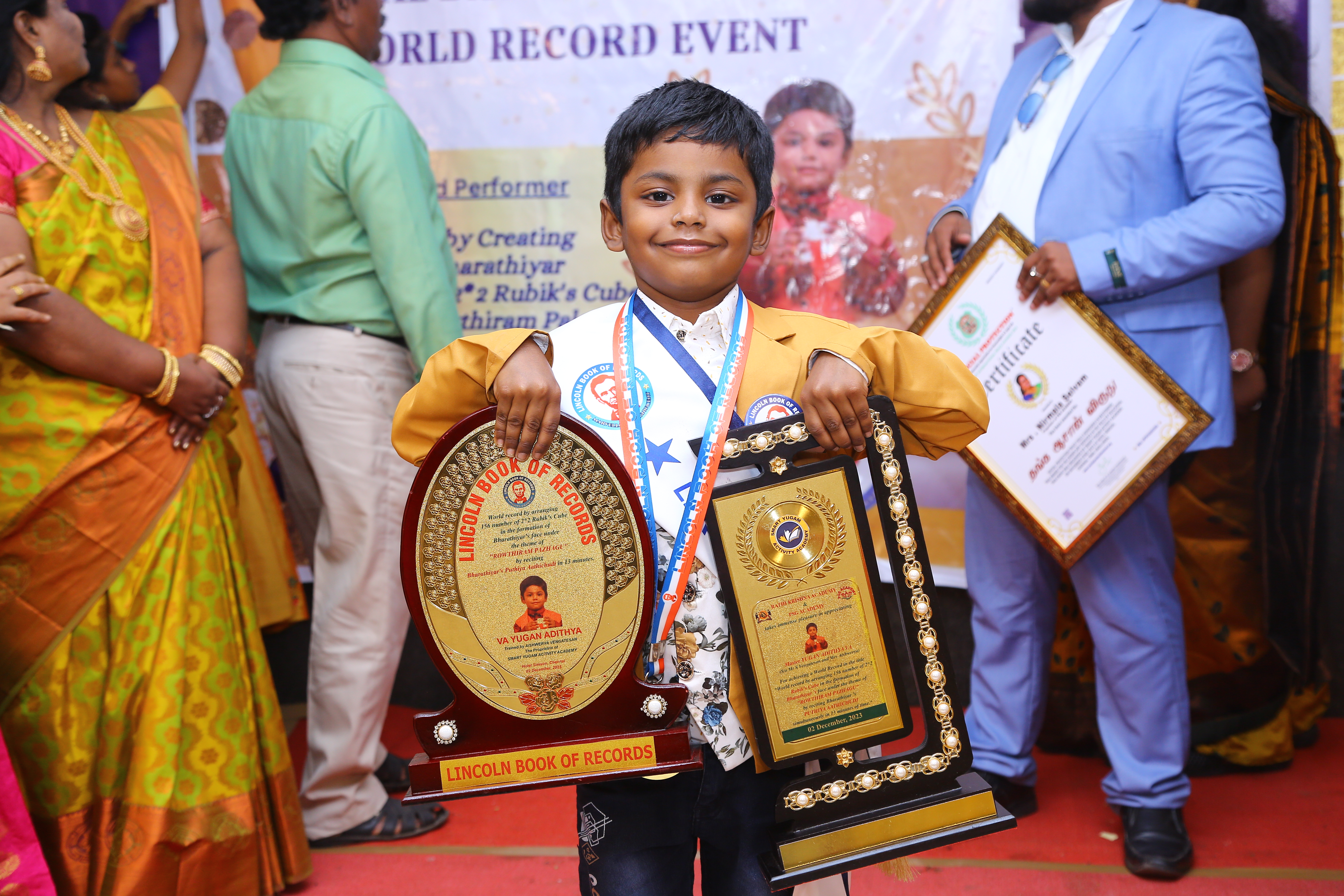 World record by arranging 156 number of 2*2 Rubik's Cube in the   formation of Bharathiyar 's face under the theme of "ROWTHIRAM PAZHAGU"  by reciting Bharathiyar 's Puthiya Aathichudi SIMULTANEOUSLy in least time.