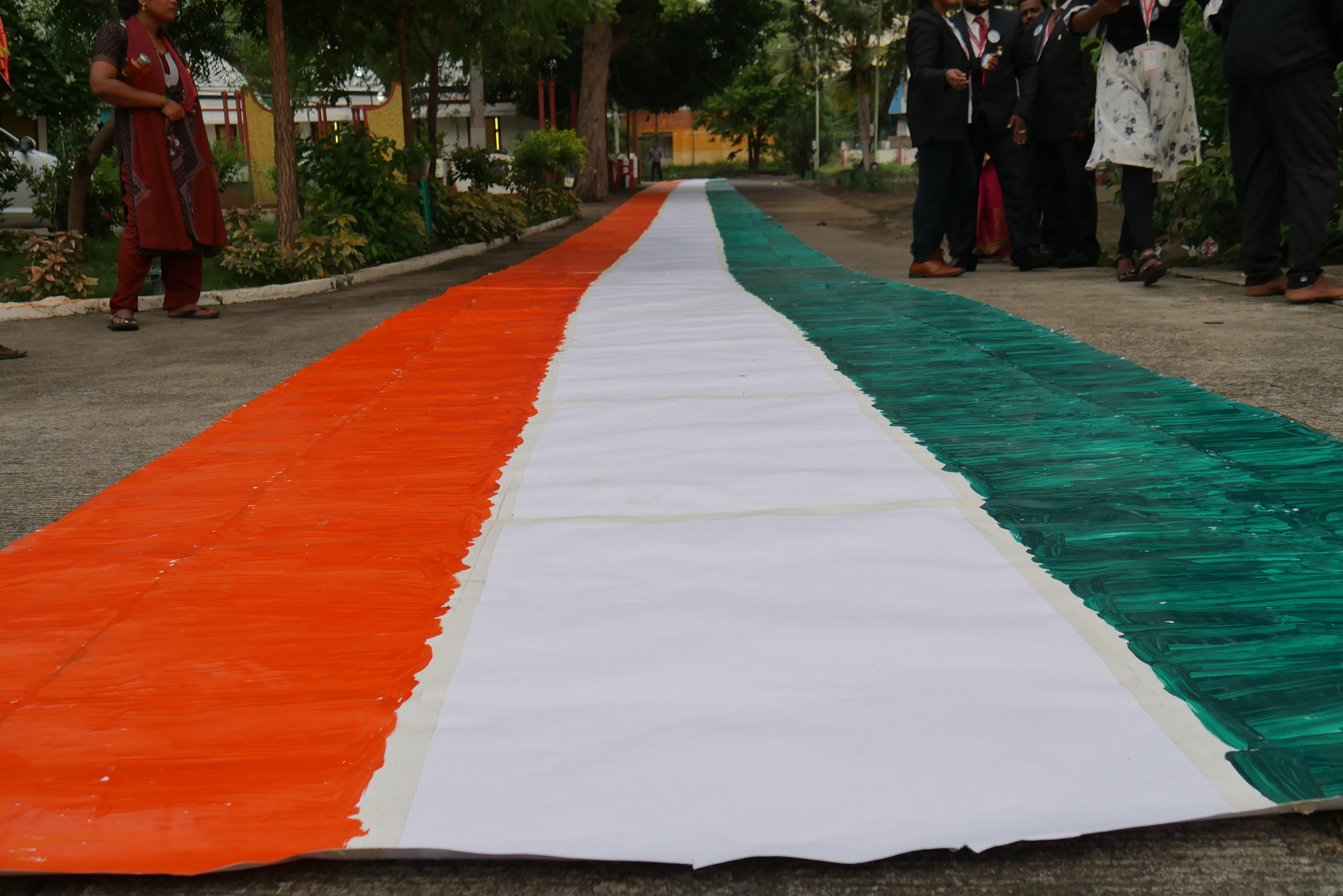 THE FIRST PERSON IN THE WORLD, TO DRAW THE LONGEST INDIAN NATIONAL FLAG  NON-STOP FOR 49 HOURS USING HIS TONGUE ONLY