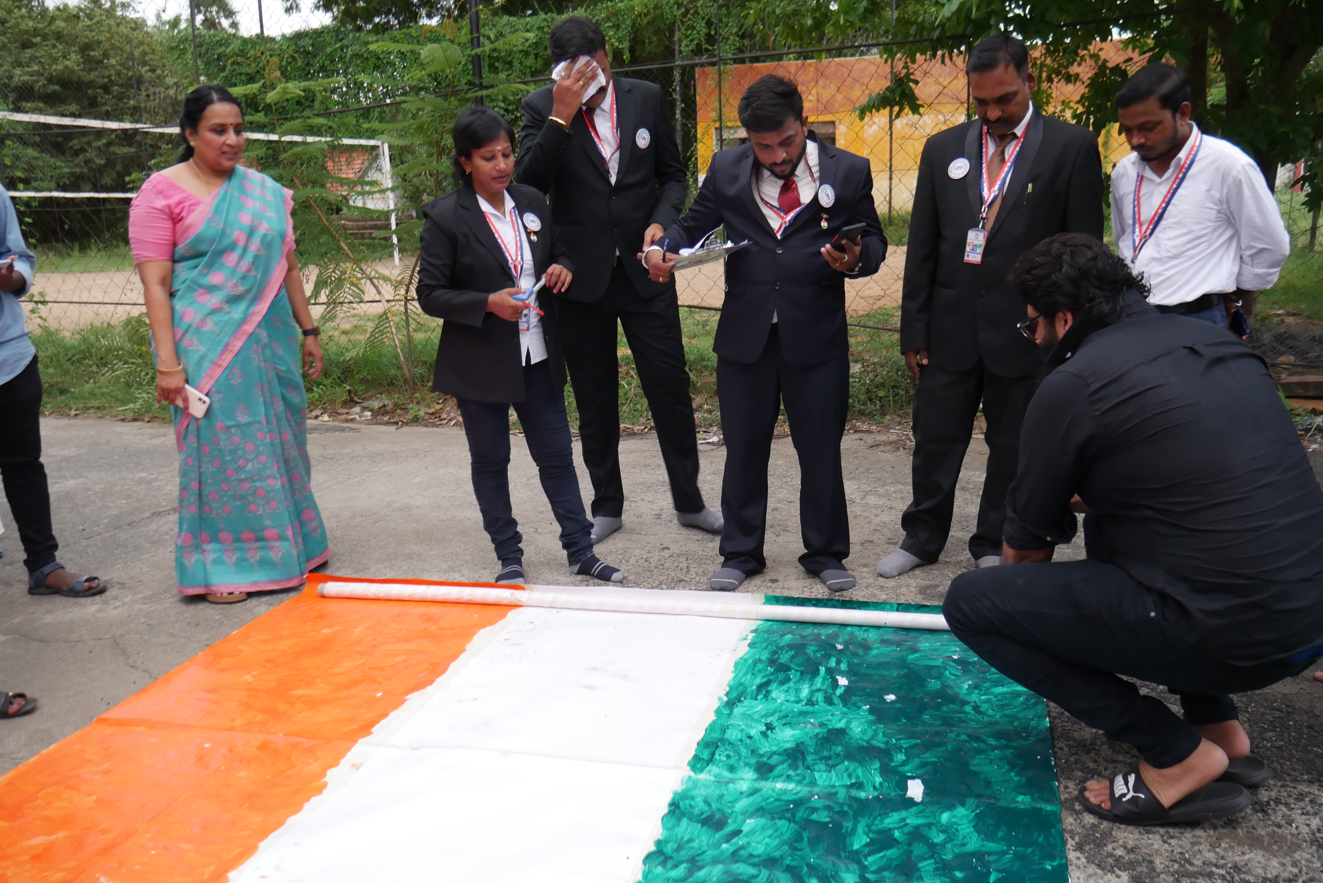 THE FIRST PERSON IN THE WORLD, TO DRAW THE LONGEST INDIAN NATIONAL FLAG  NON-STOP FOR 49 HOURS USING HIS TONGUE ONLY