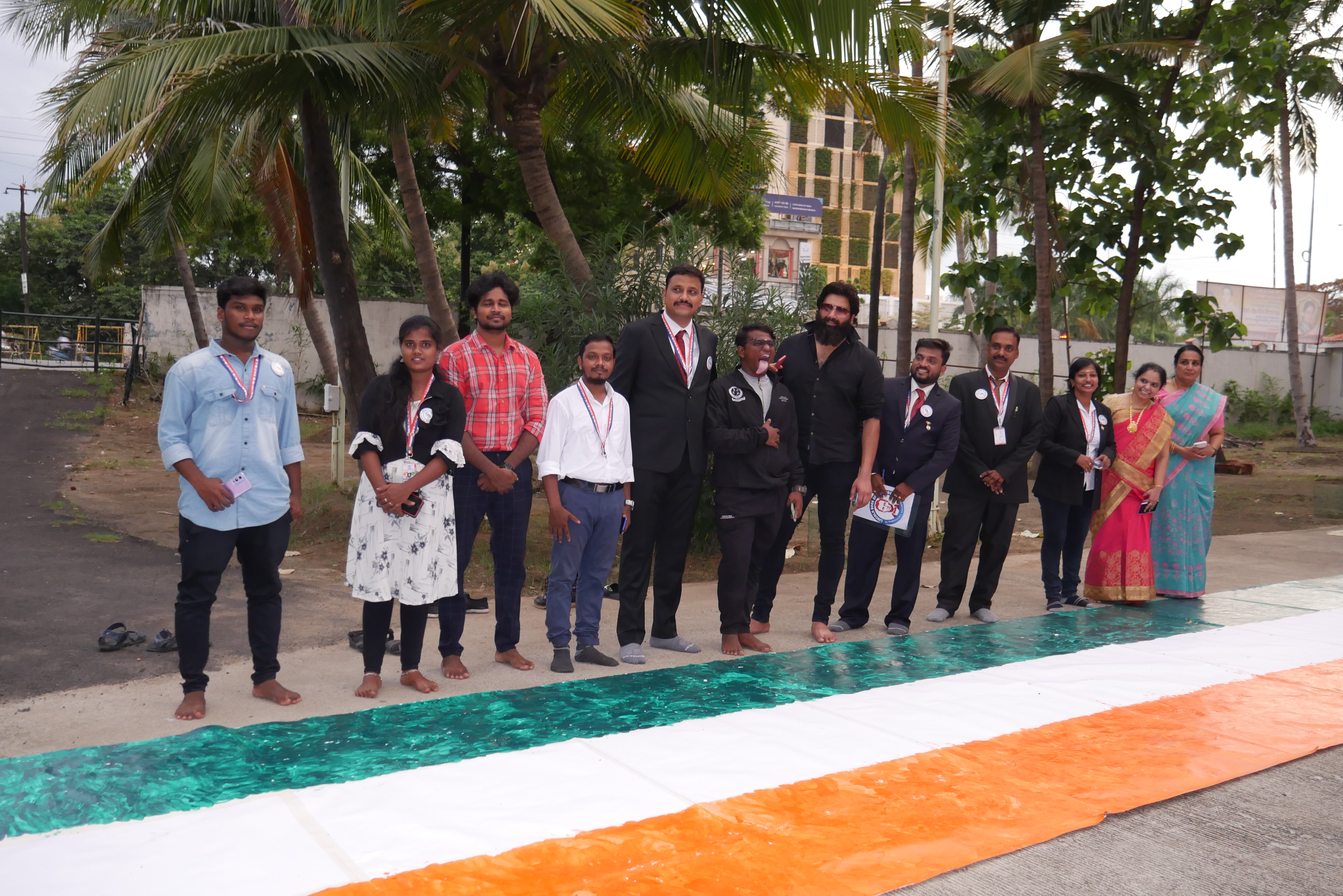 THE FIRST PERSON IN THE WORLD, TO DRAW THE LONGEST INDIAN NATIONAL FLAG  NON-STOP FOR 49 HOURS USING HIS TONGUE ONLY