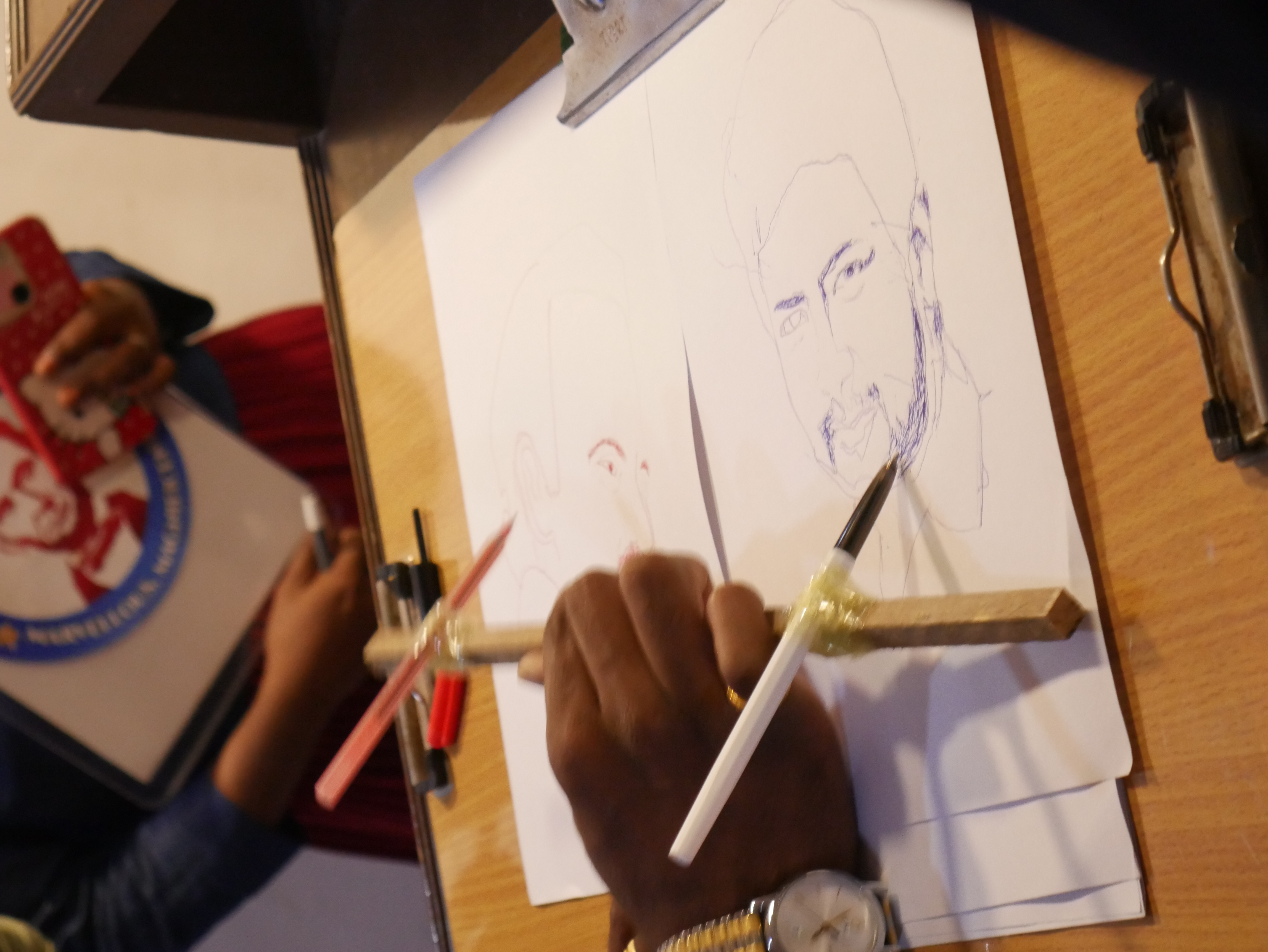 World record for drawing 2 Arts in  10 minutes with two pencils in one hand.