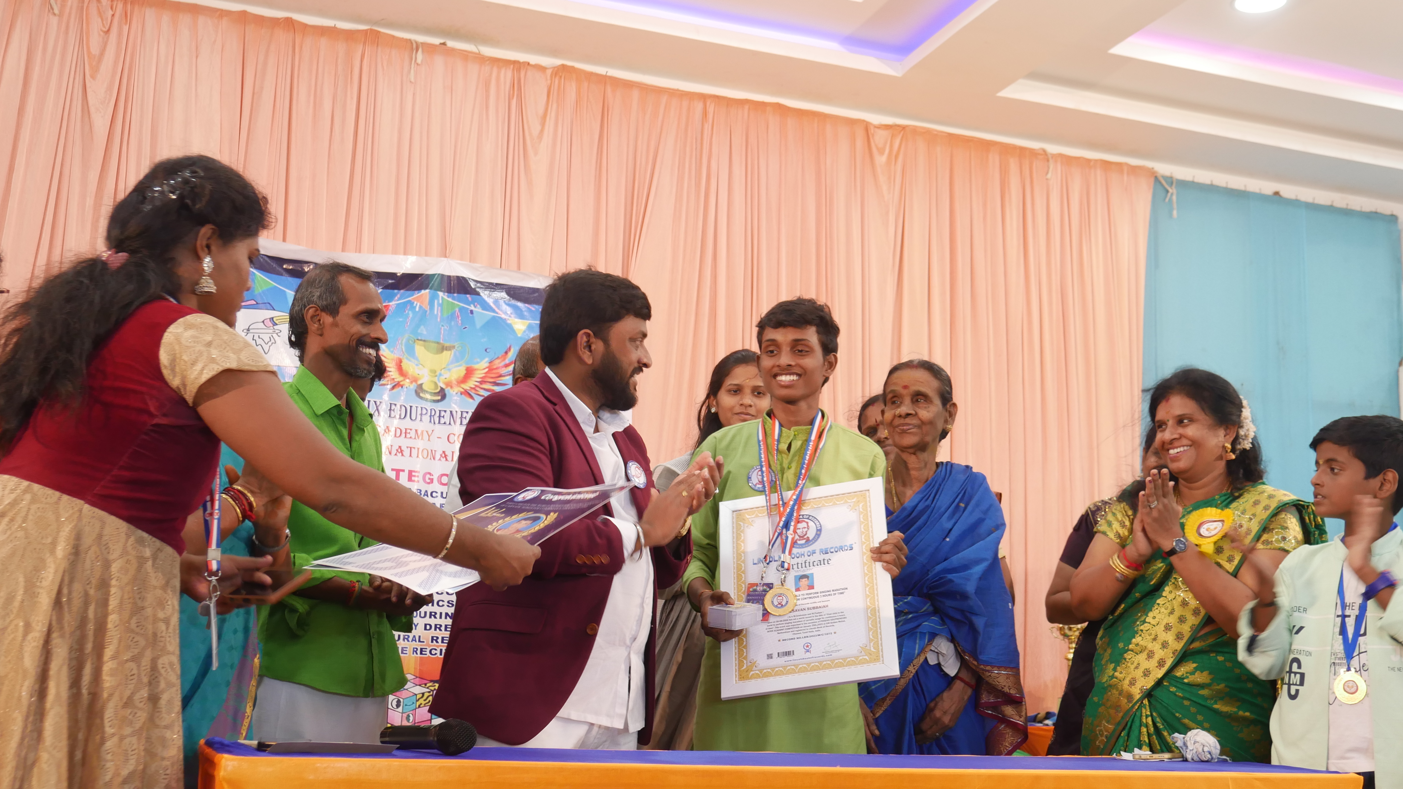 "First child in the world to perform singing marathon  of carnatic songs for continuous 3 hours of time"