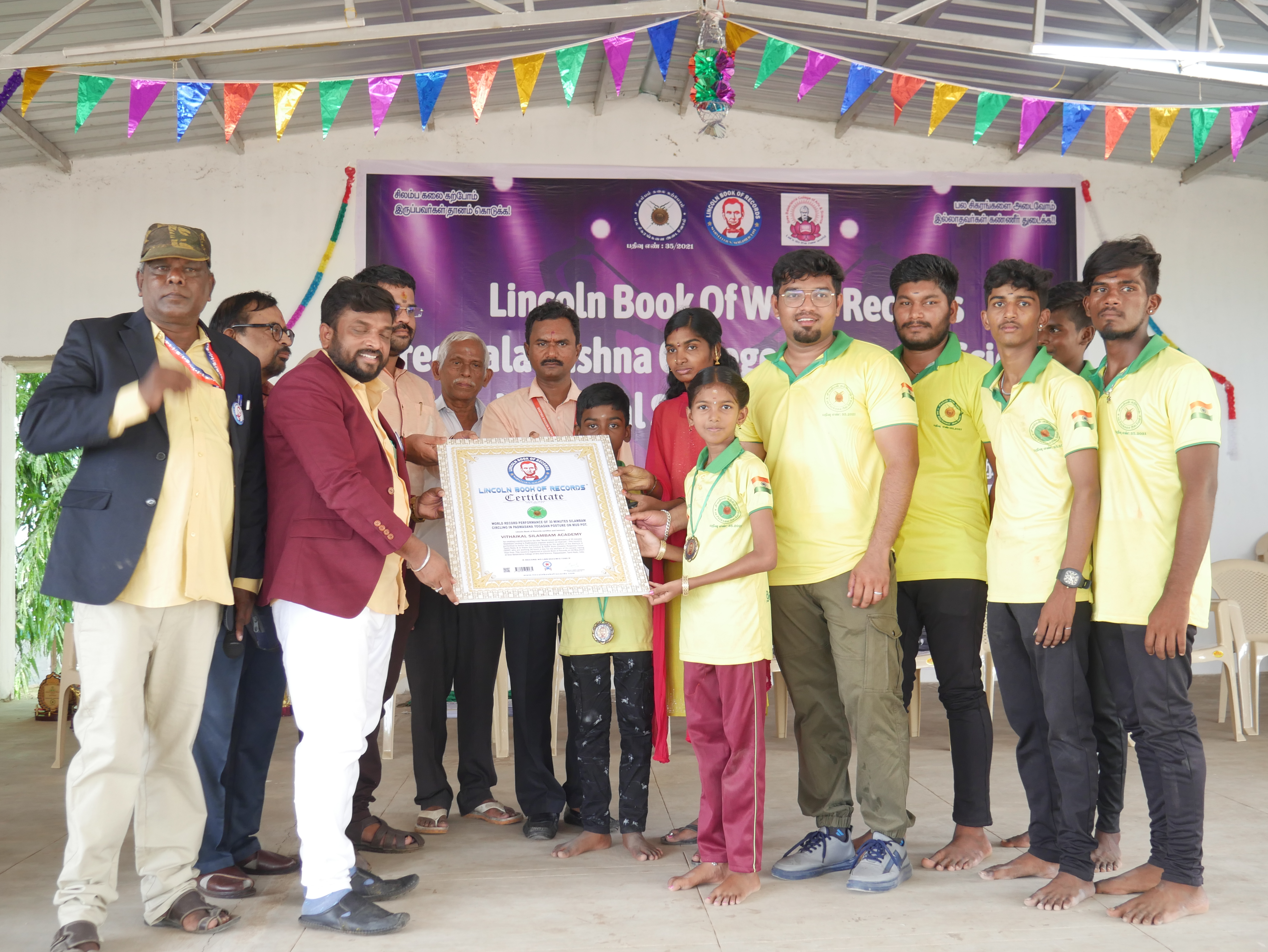 World record performance of 30 minutes Silambam  circling in Padmasana yogasan posture on mud pot.