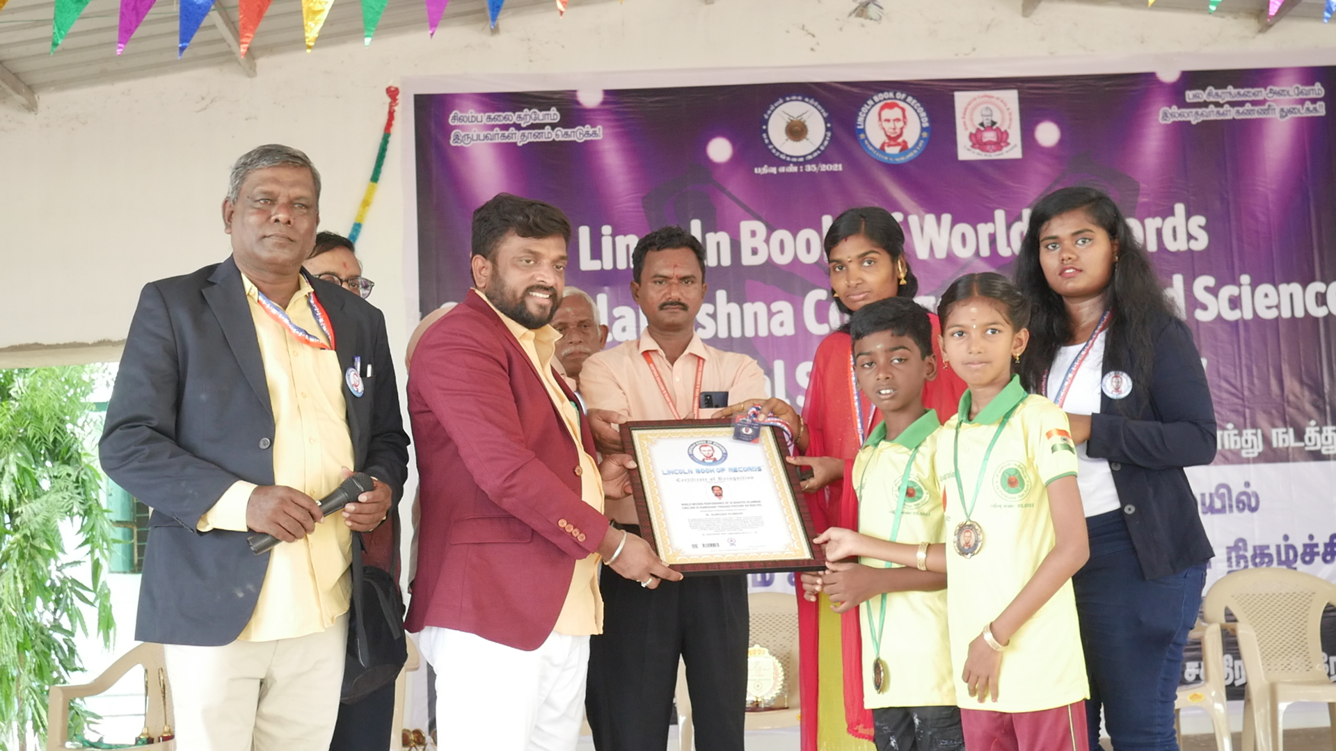 World record performance of 30 minutes Silambam  circling in Padmasana yogasan posture on mud pot.