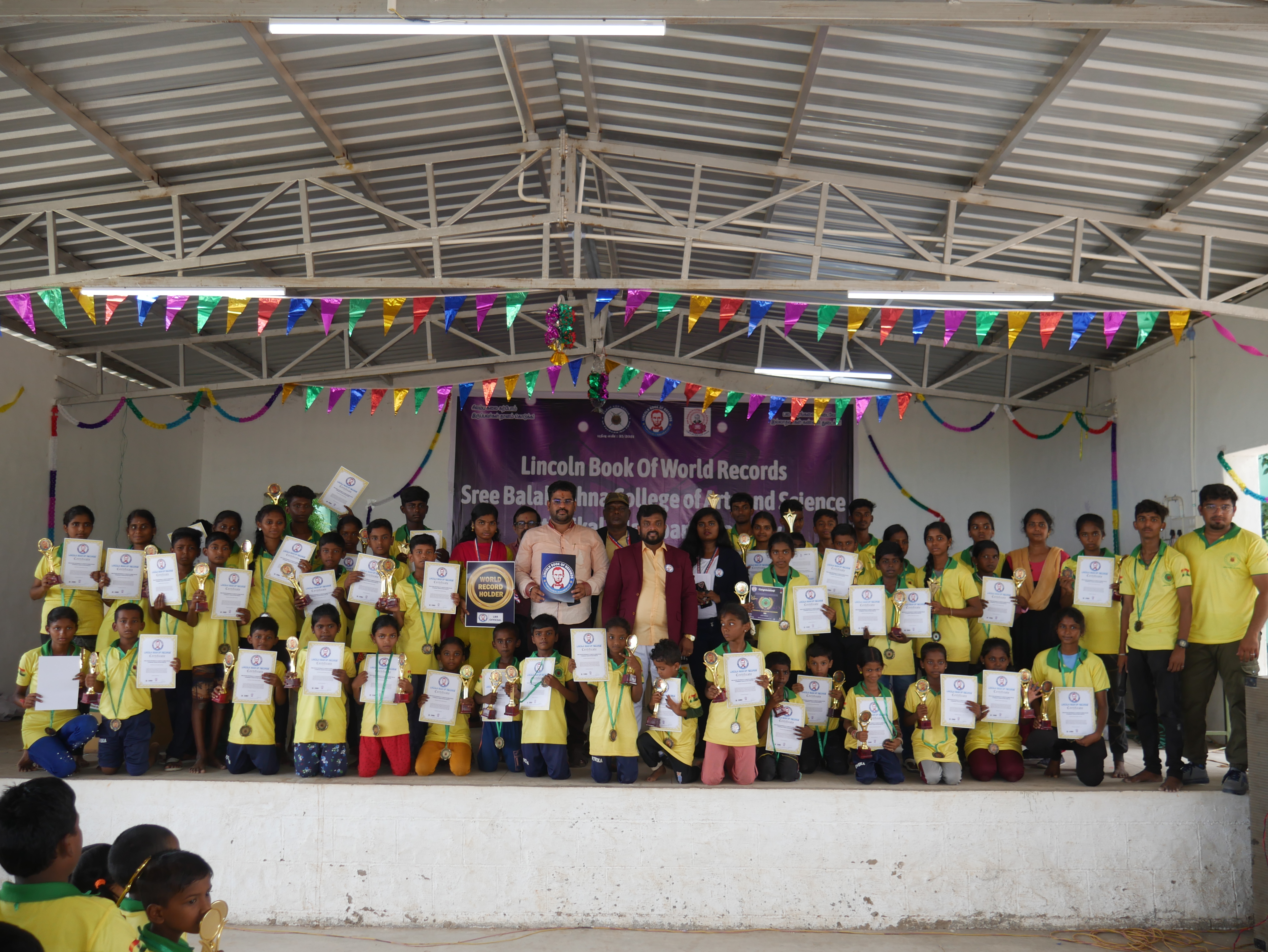 World record performance of 30 minutes Silambam  circling in Padmasana yogasan posture on mud pot.