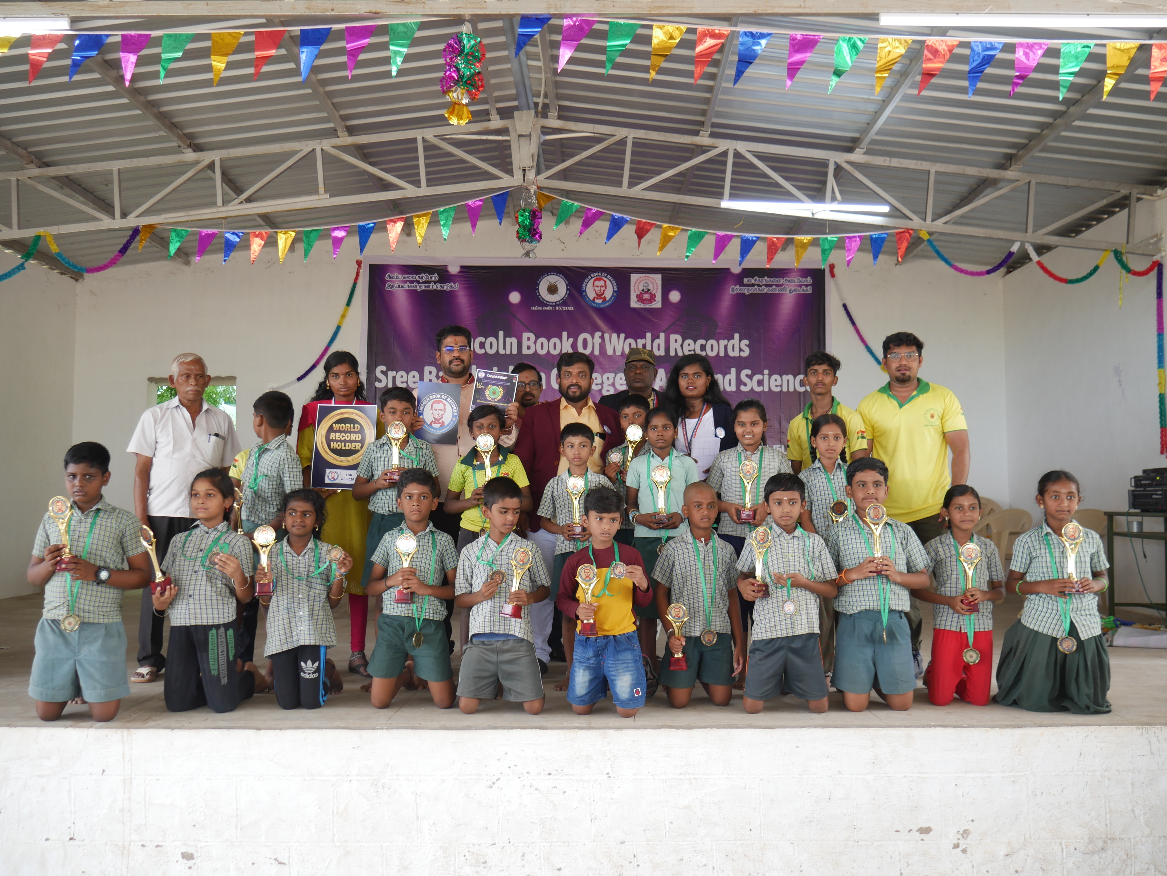 World record performance of 30 minutes Silambam  circling in Padmasana yogasan posture on mud pot.