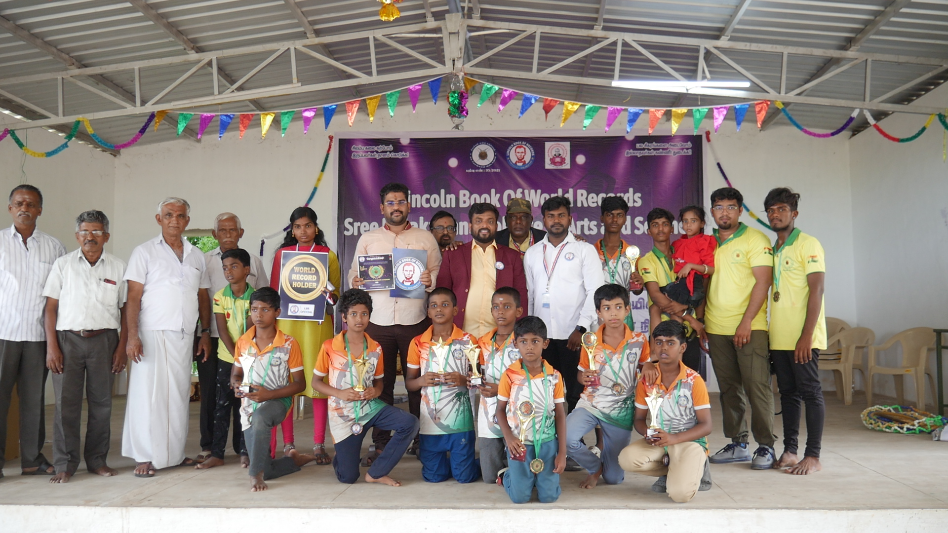 World record performance of 30 minutes Silambam  circling in Padmasana yogasan posture on mud pot.