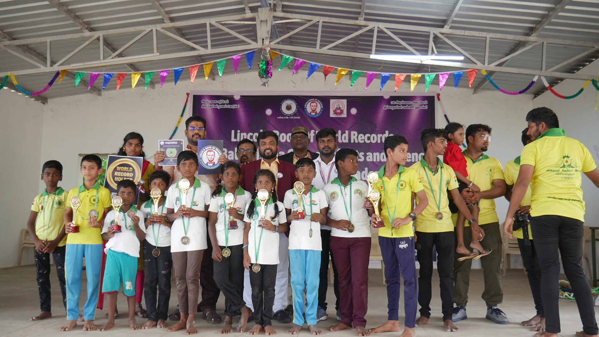 World record performance of 30 minutes Silambam  circling in Padmasana yogasan posture on mud pot.