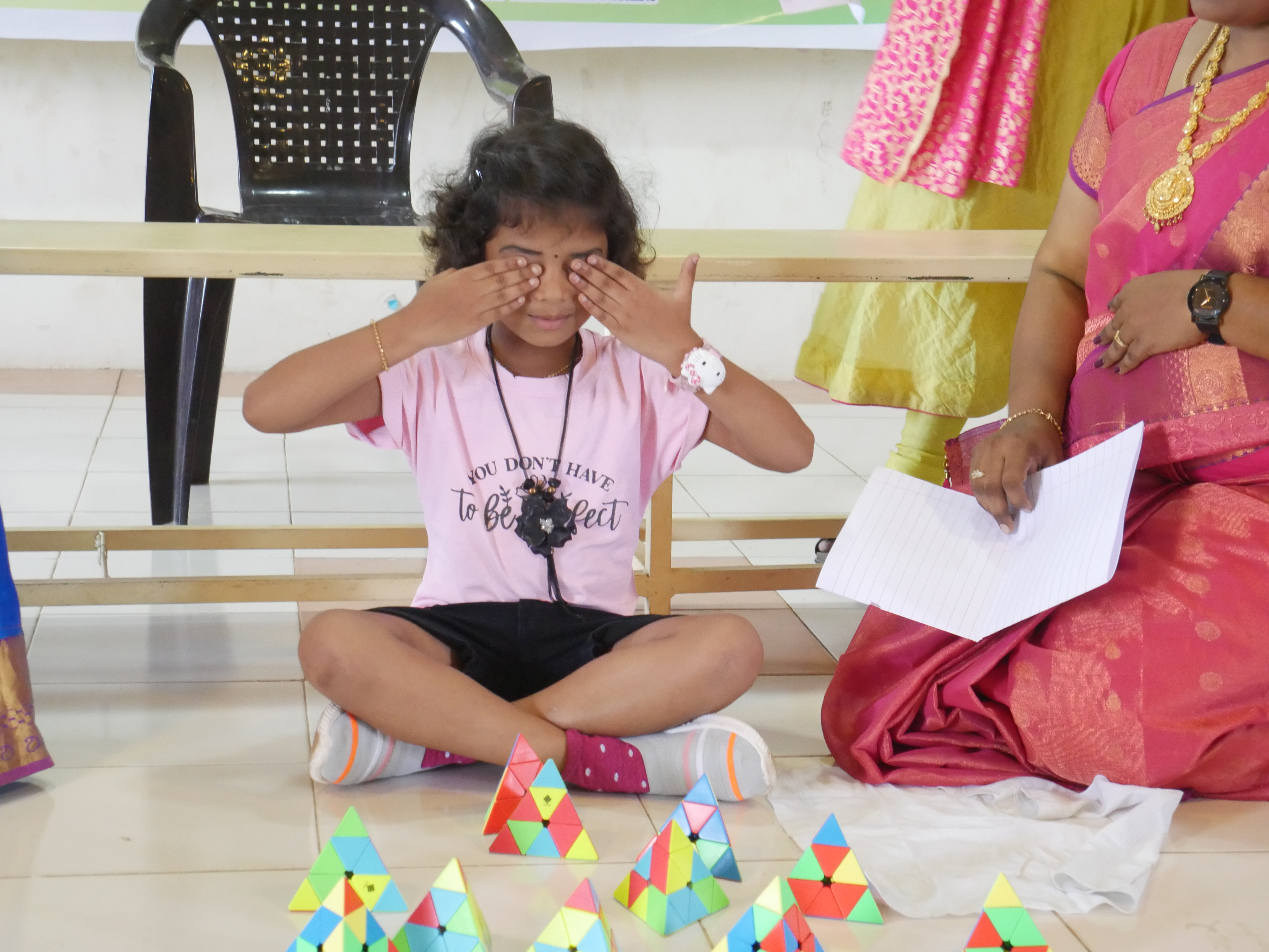 World's youngest child to solve larger number of Pyramid Rubik's Cube  by reciting multiple Tamil articles  simultaneously in 06 minutes.