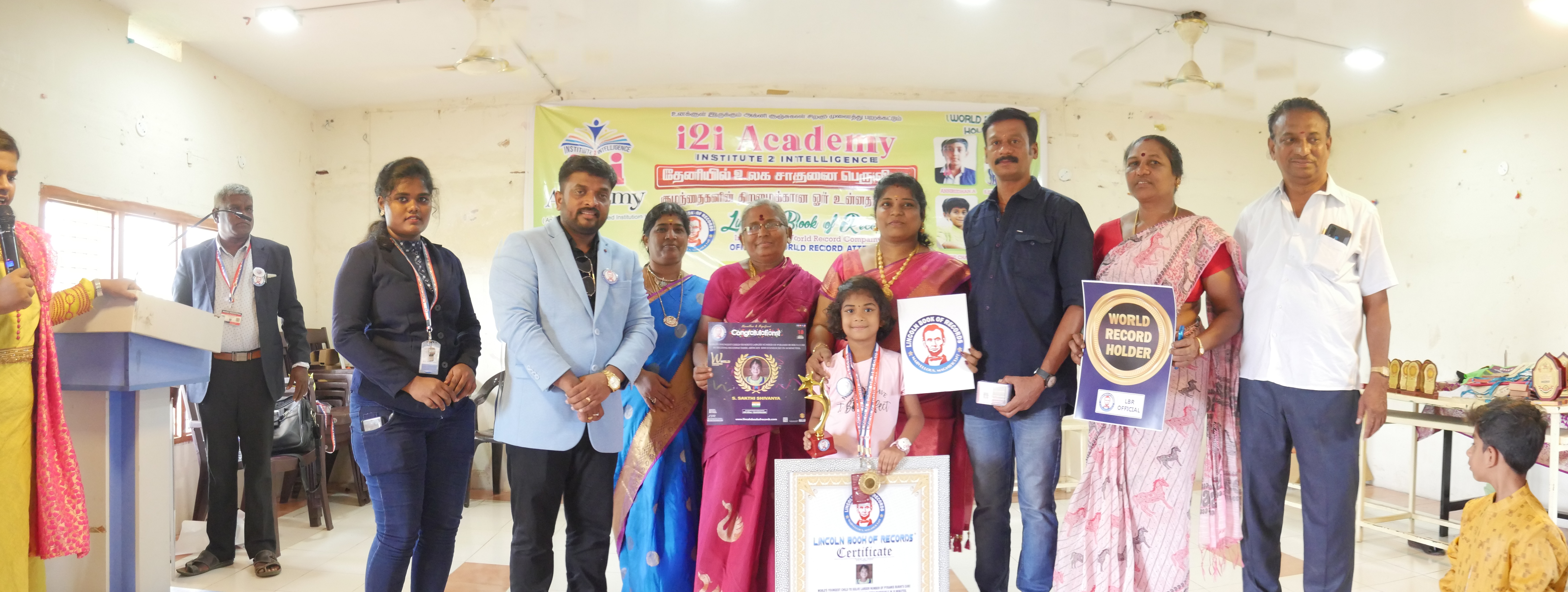 World's youngest child to solve larger number of Pyramid Rubik's Cube  by reciting multiple Tamil articles  simultaneously in 06 minutes.