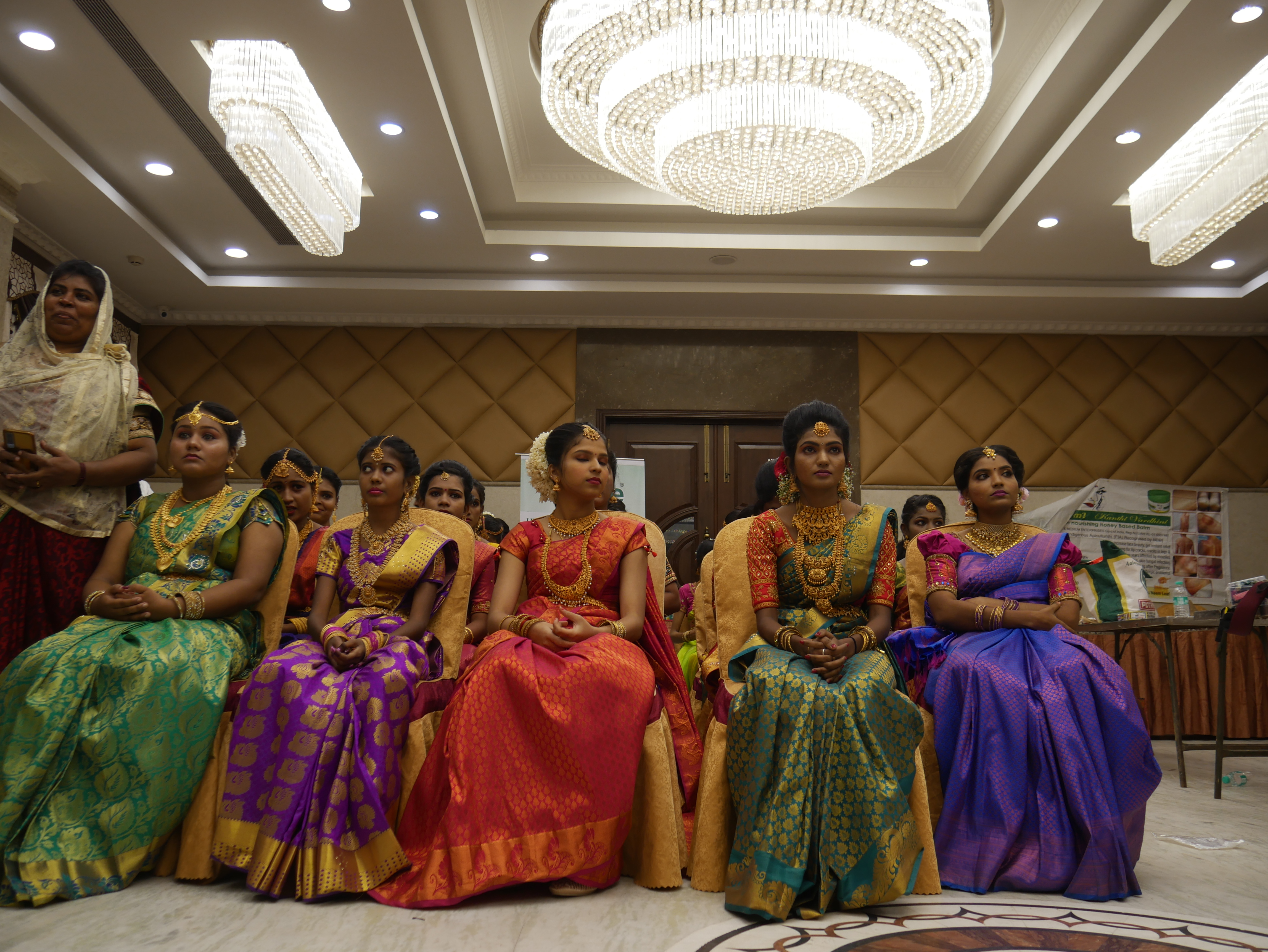 Most number of beauticians gathered together  performing Hindu bridal makeup on models in least time.