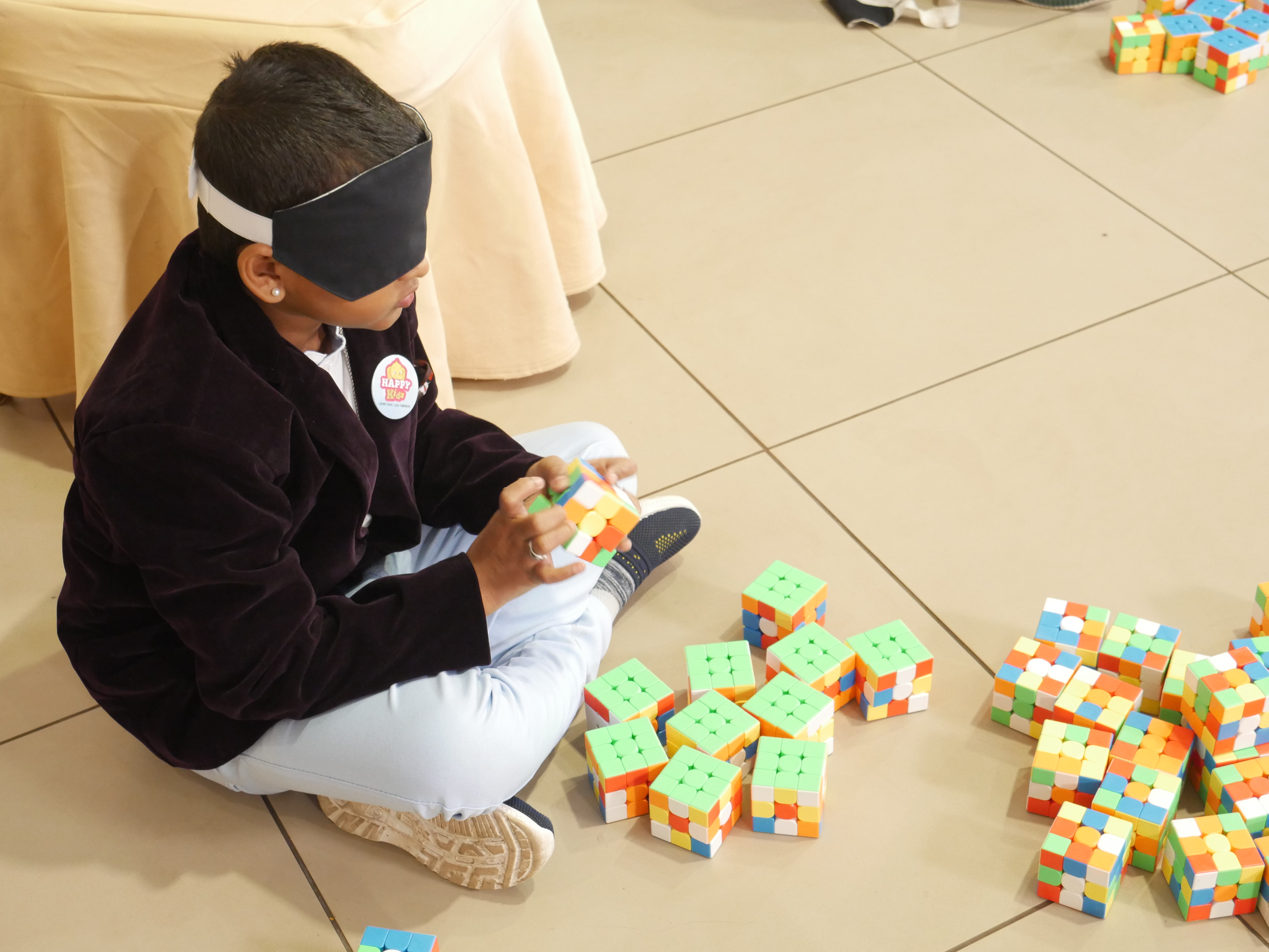 "World record by solving 81 - 3*3 Rubik’s cube and arranging them in Indian National  flag by blindfolded using Mid Brain Activation Technique in least time"