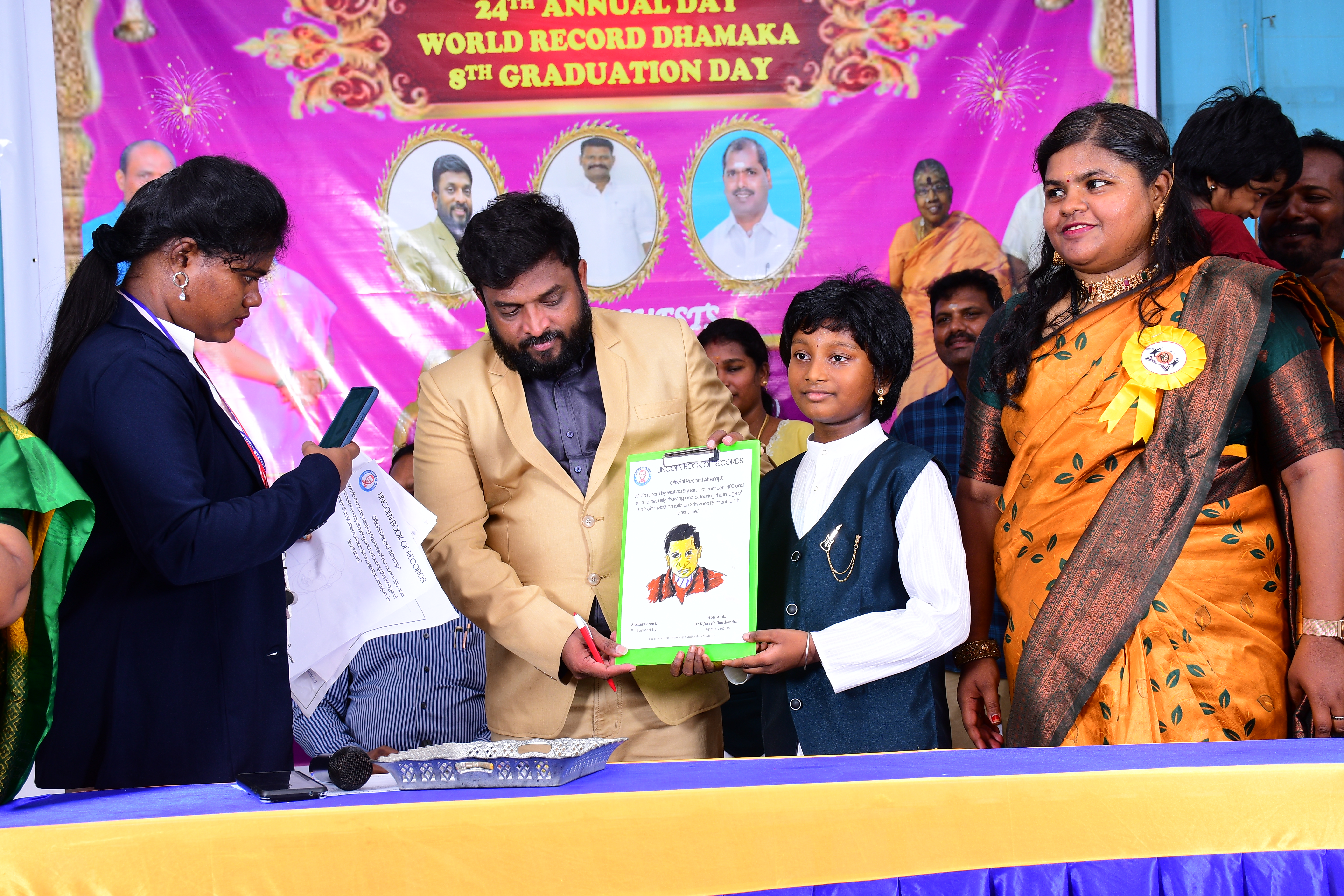 World record by reciting Squares of number 1-100 and simultaneously drawing and colouring the Image of the Indian Mathematician Srinivasa Ramanujan  in 5 minutes of time.