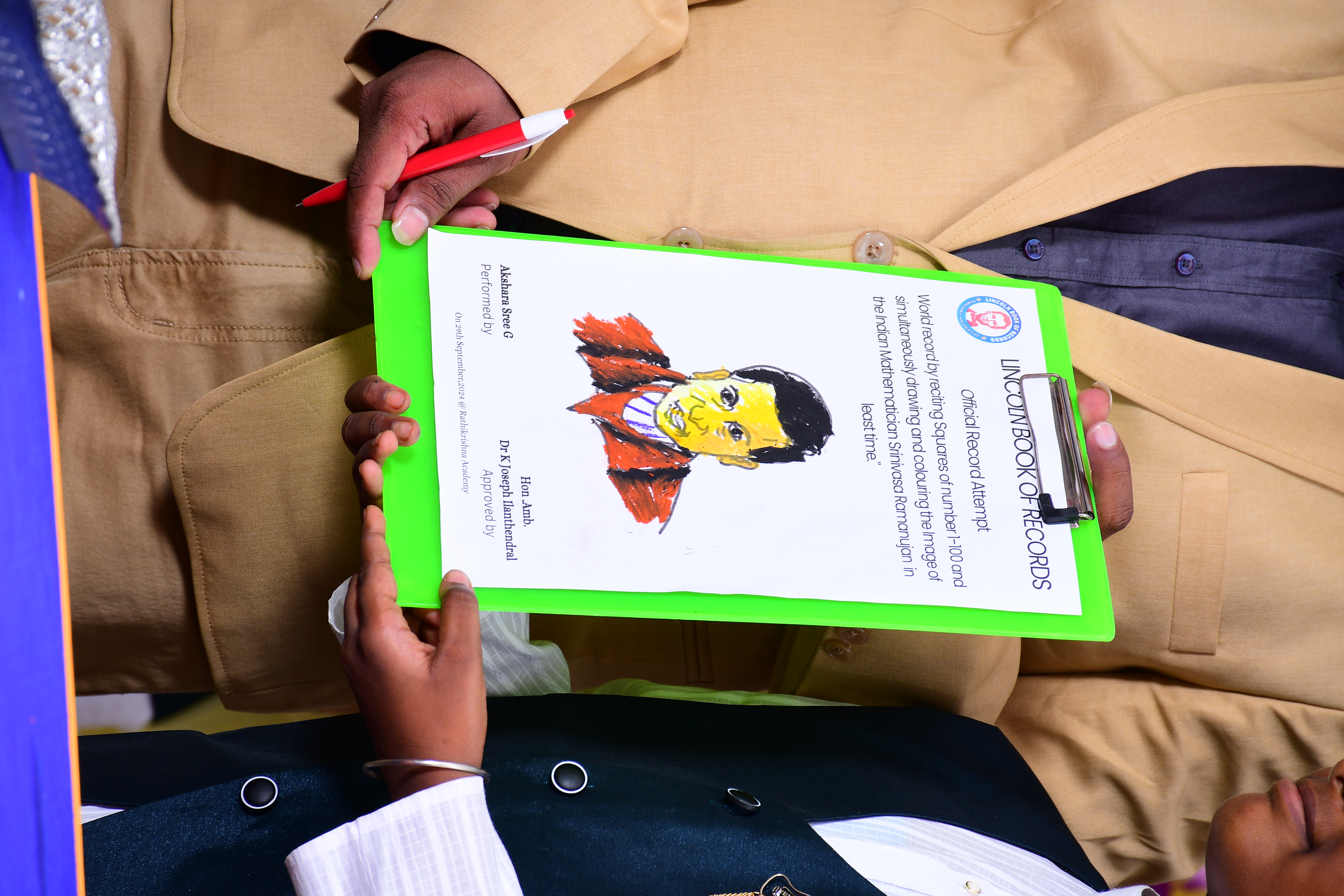 World record by reciting Squares of number 1-100 and simultaneously drawing and colouring the Image of the Indian Mathematician Srinivasa Ramanujan  in 5 minutes of time.