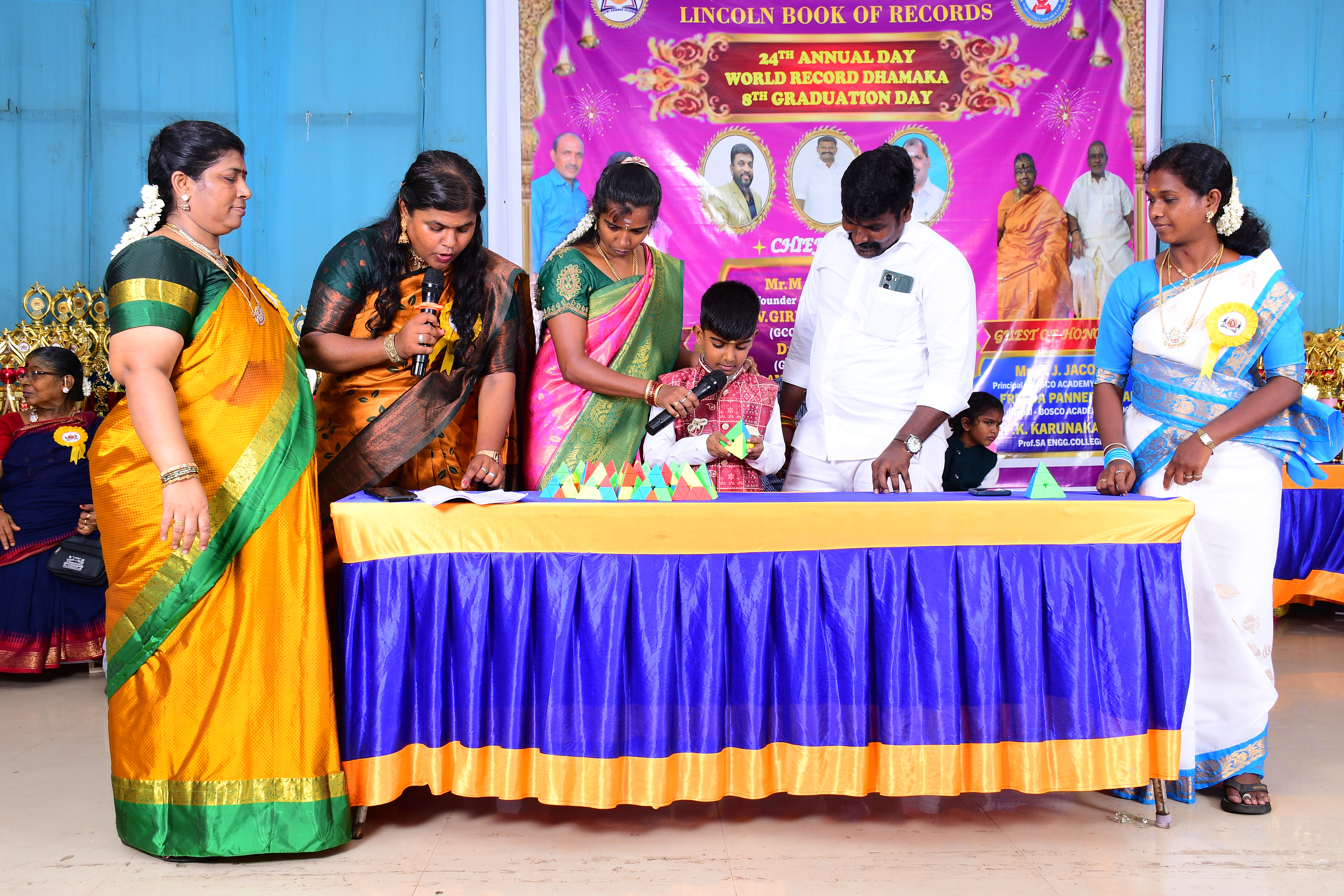 World youngest child to solve 20 pyramid Rubik's cube and to answer 150 general knowledge questions about The Indian National simultaneously in 7 minutes .