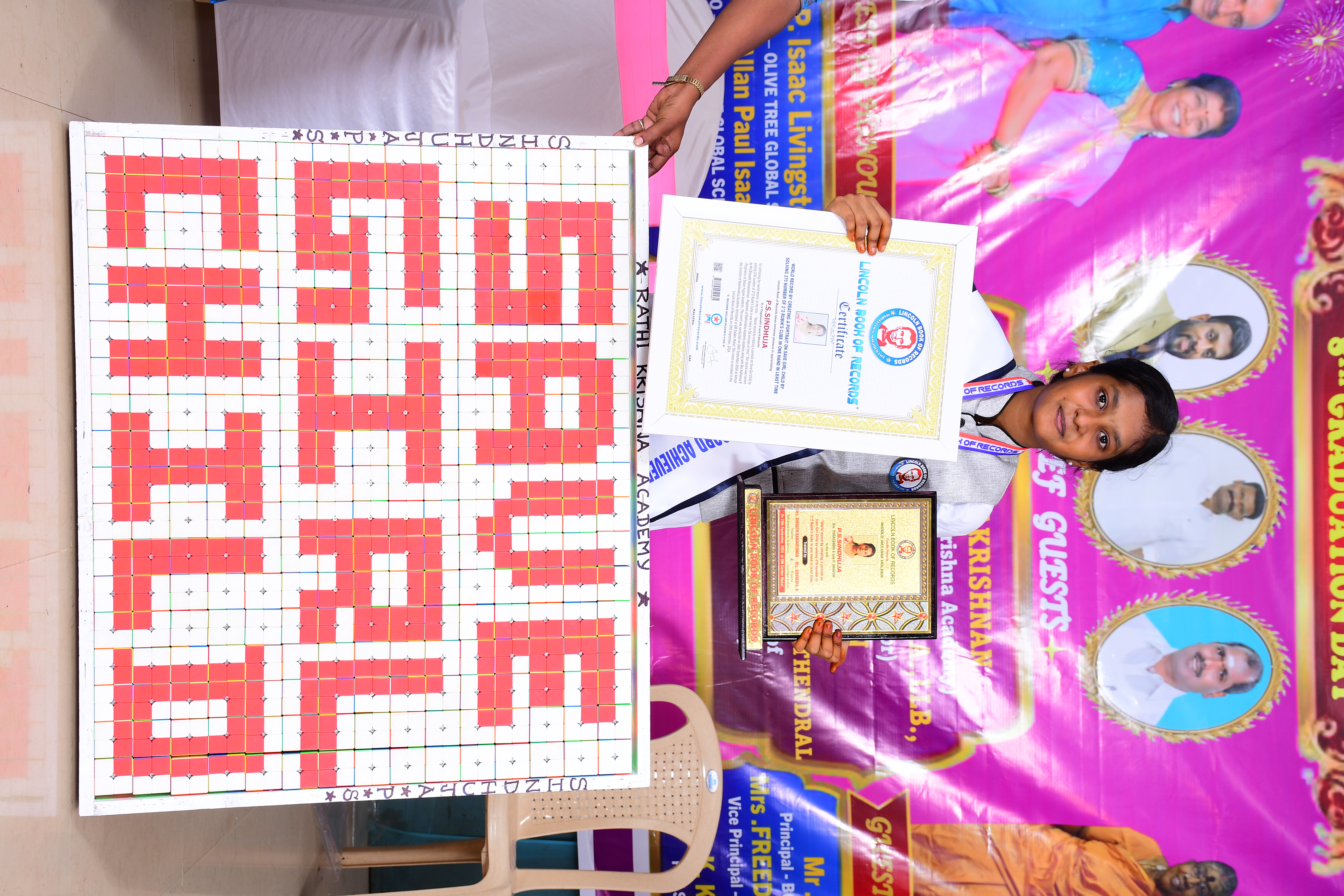 World record by creating a portrait on Save Girl Child by solving 270 number of 2*2 Rubik's Cube in one hand in 40 minutes of time.